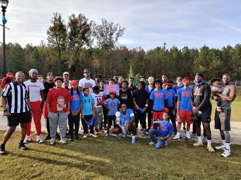 Teen and youth group gathered outdoors at a church event.