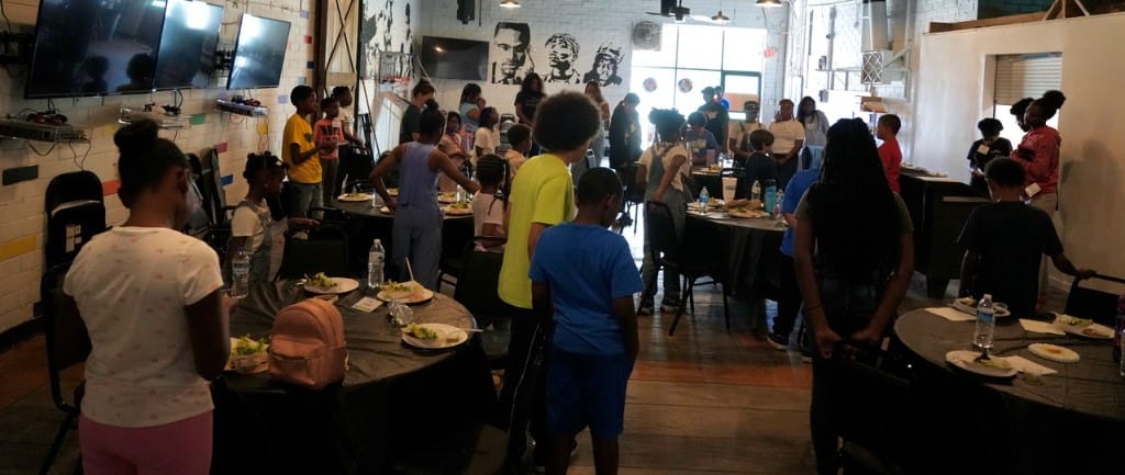 Church community connecting during an indoor fellowship event.