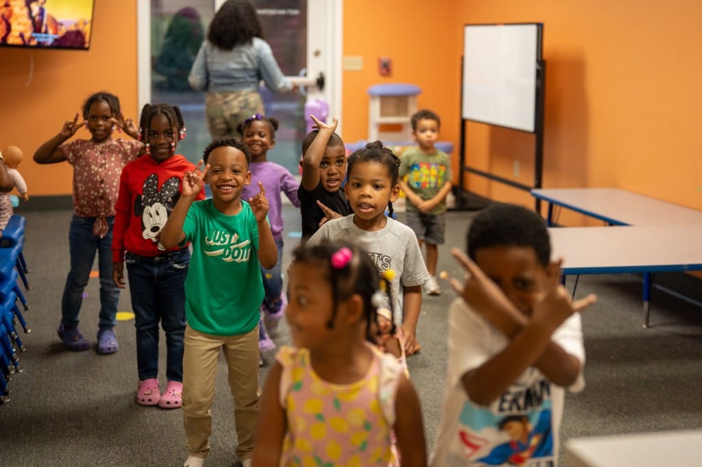 Kids smiling and having fun during children's ministry.