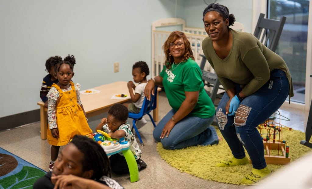 Nursery volunteers caring for children in Chosen Kids.