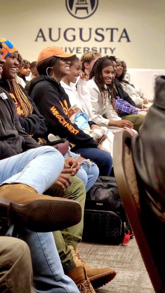 Young adults gathered at an Augusta University community event.