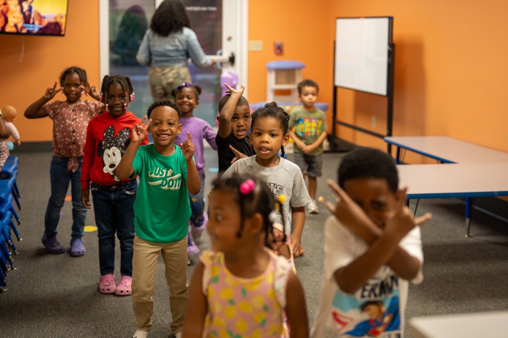 Kids smiling and having fun during children's ministry.